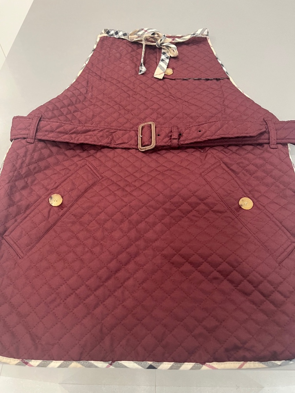 Burberry Cranberry-Colored Apron with Burberry Print.